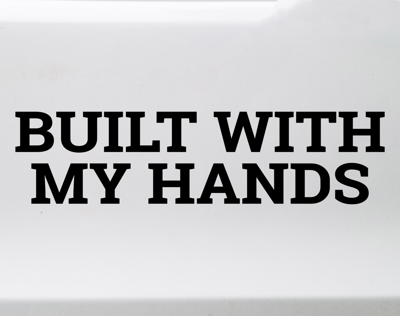 Built With My Hands vinyl decal featuring bold lettering celebrating maker pride and hands-on workshop craftsmanship on a white background