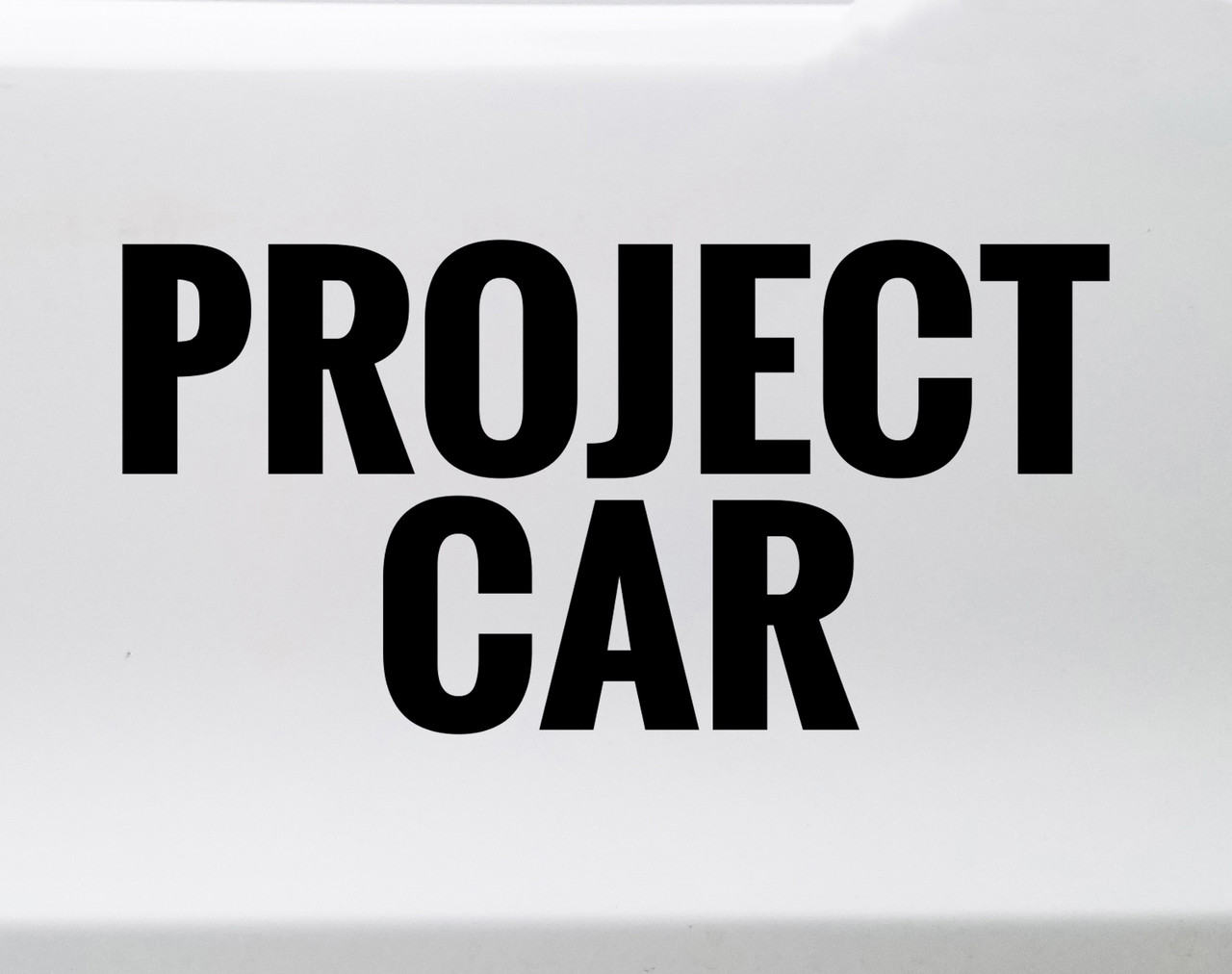 Project Car Vinyl Decal Garage Build Automotive Enthusiast Sticker featuring bold automotive lettering in solid black on a white background