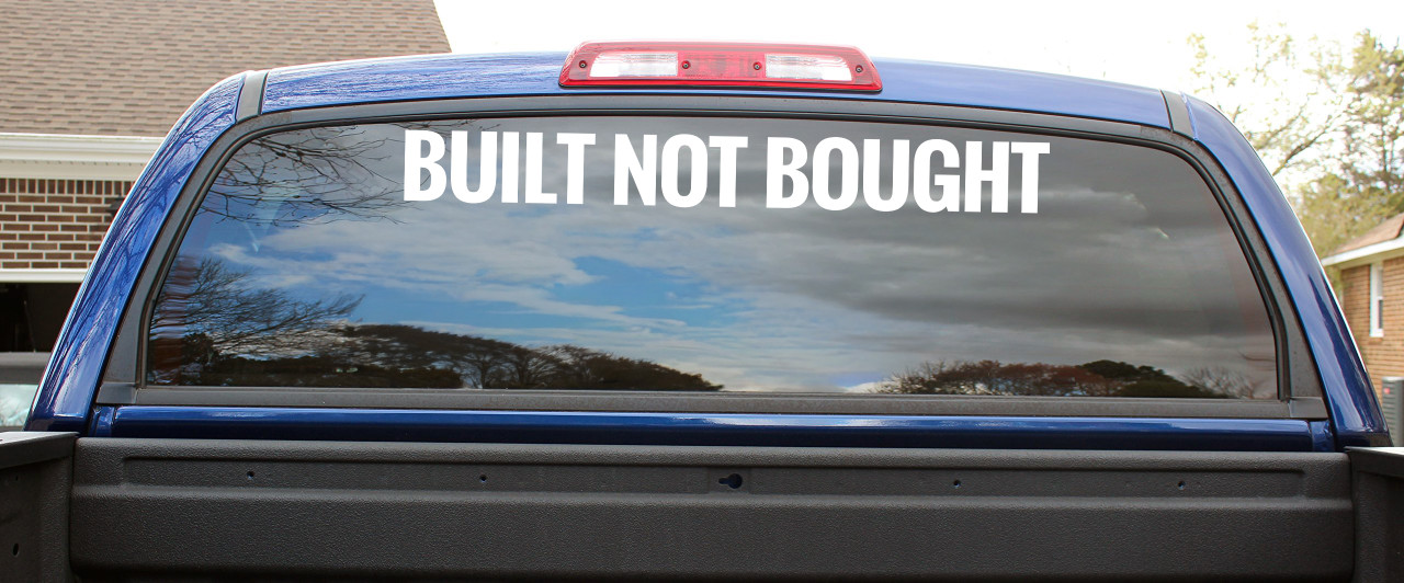 Built Not Bought windshield vinyl decal banner applied across top of vehicle glass