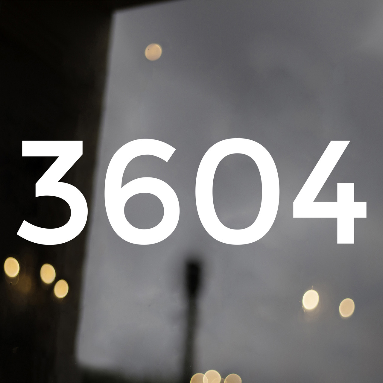 Large storefront address numbers vinyl decal in Montserrat font with modern minimalist business signage style