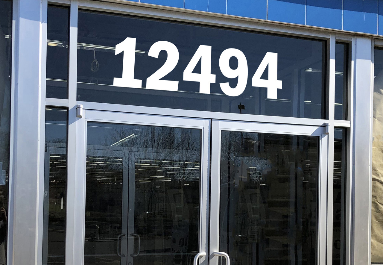 Large storefront address numbers vinyl decal in Franklin Gothic Demi Condensed font with modern minimalist business signage style