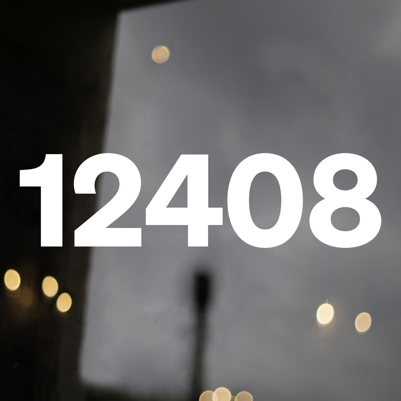 Sohne Bold storefront address numbers vinyl sticker decal applied to business window with clean modern sans serif lettering