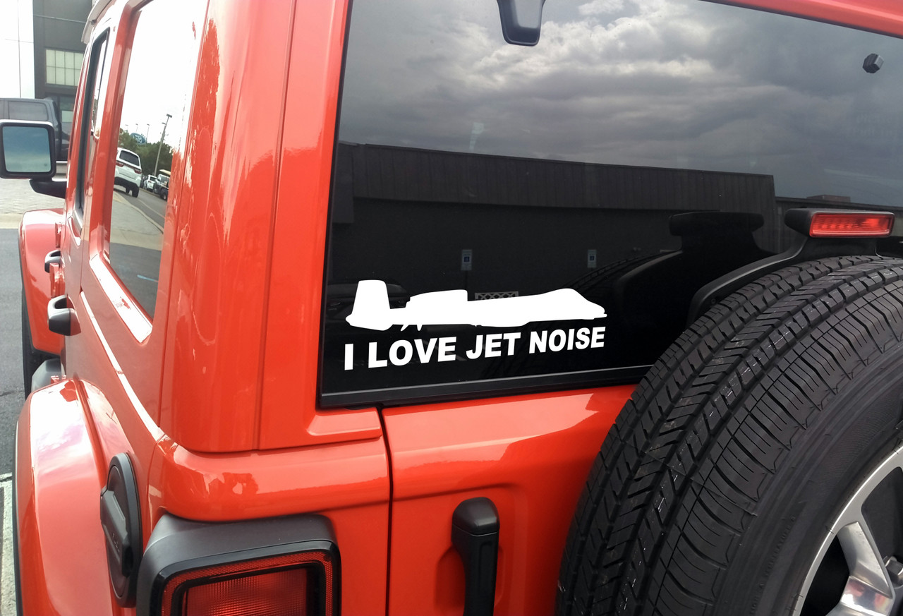 I Love Jet Noise vinyl sticker decal with A-10 style military fighter jet silhouette applied to car window