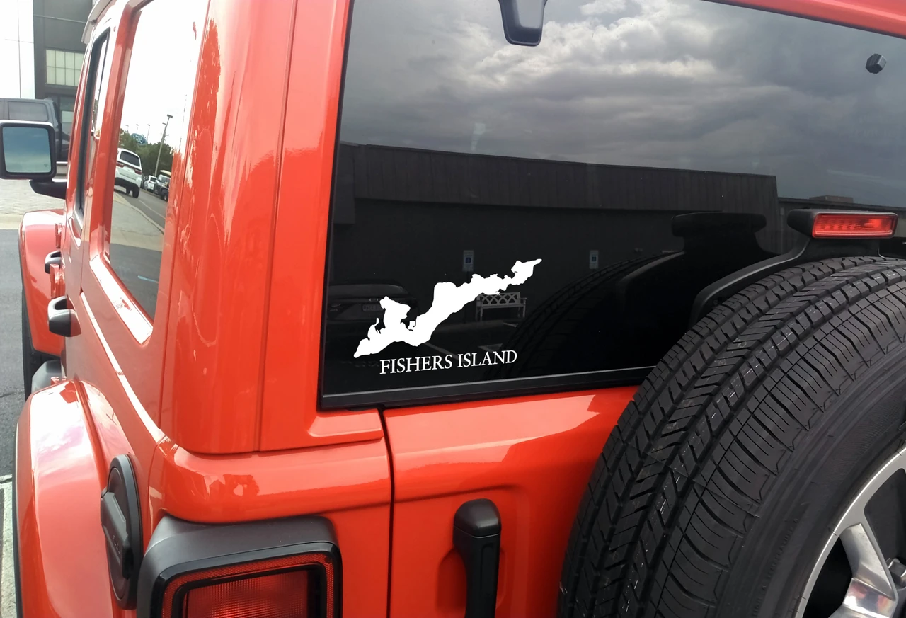 Fishers Island outline vinyl sticker decal applied to car window showing coastal New York map shape in Long Island Sound