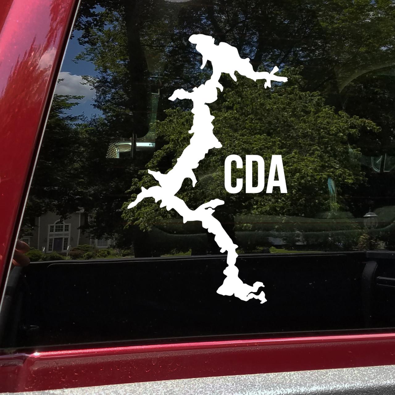 Lake Coeur d Alene outline vinyl sticker decal applied to car window showing Idaho lake map shape in CDA region near Post Falls and Spokane