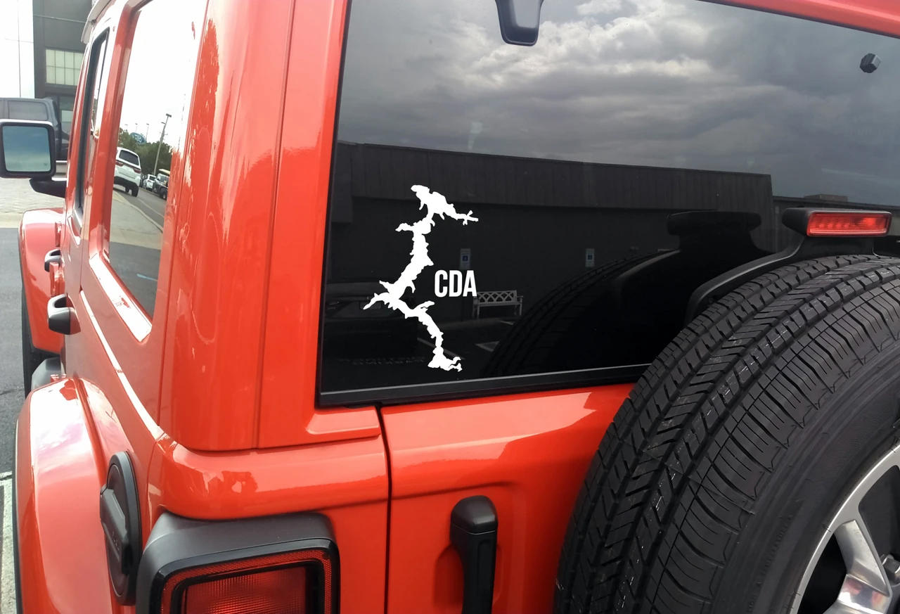 Lake Coeur d Alene outline vinyl sticker decal applied to car window showing Idaho lake map shape in CDA region near Post Falls and Spokane