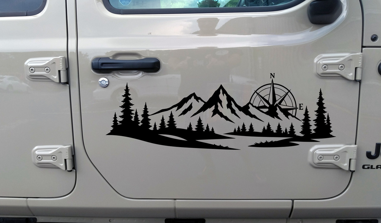 mountain forest compass rose vinyl sticker decal applied to rv camper rear window with outdoor adventure landscape design