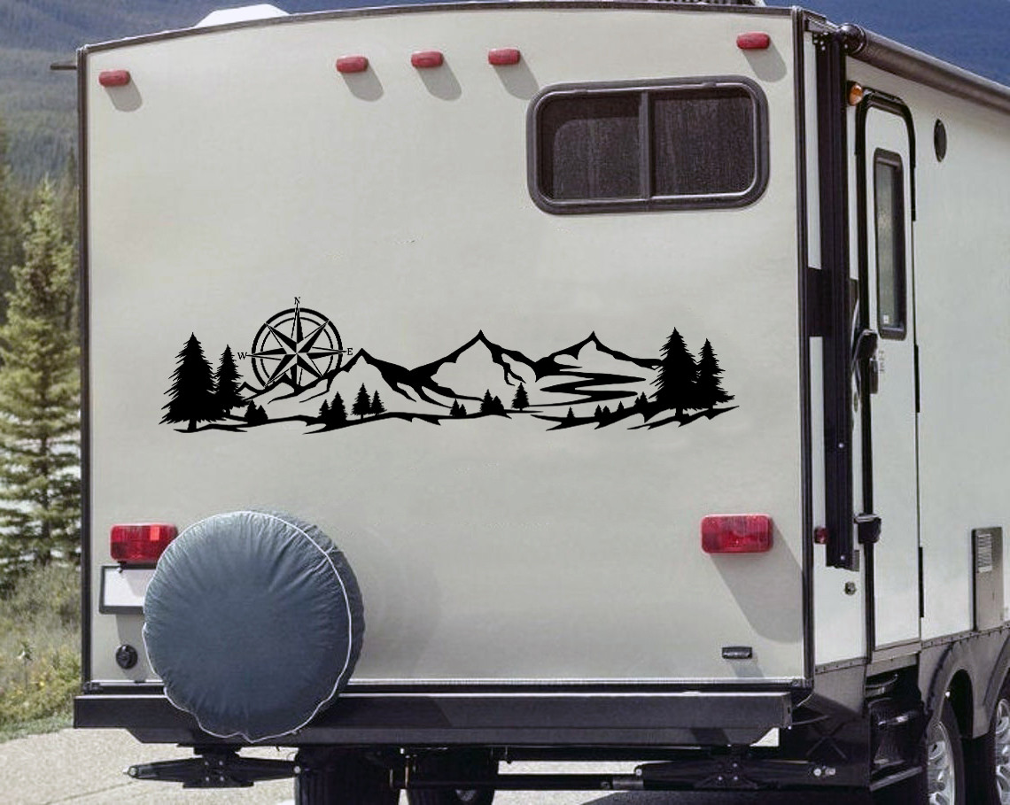 mountain compass rose vinyl sticker decal applied to rv camper rear window with outdoor wilderness adventure design