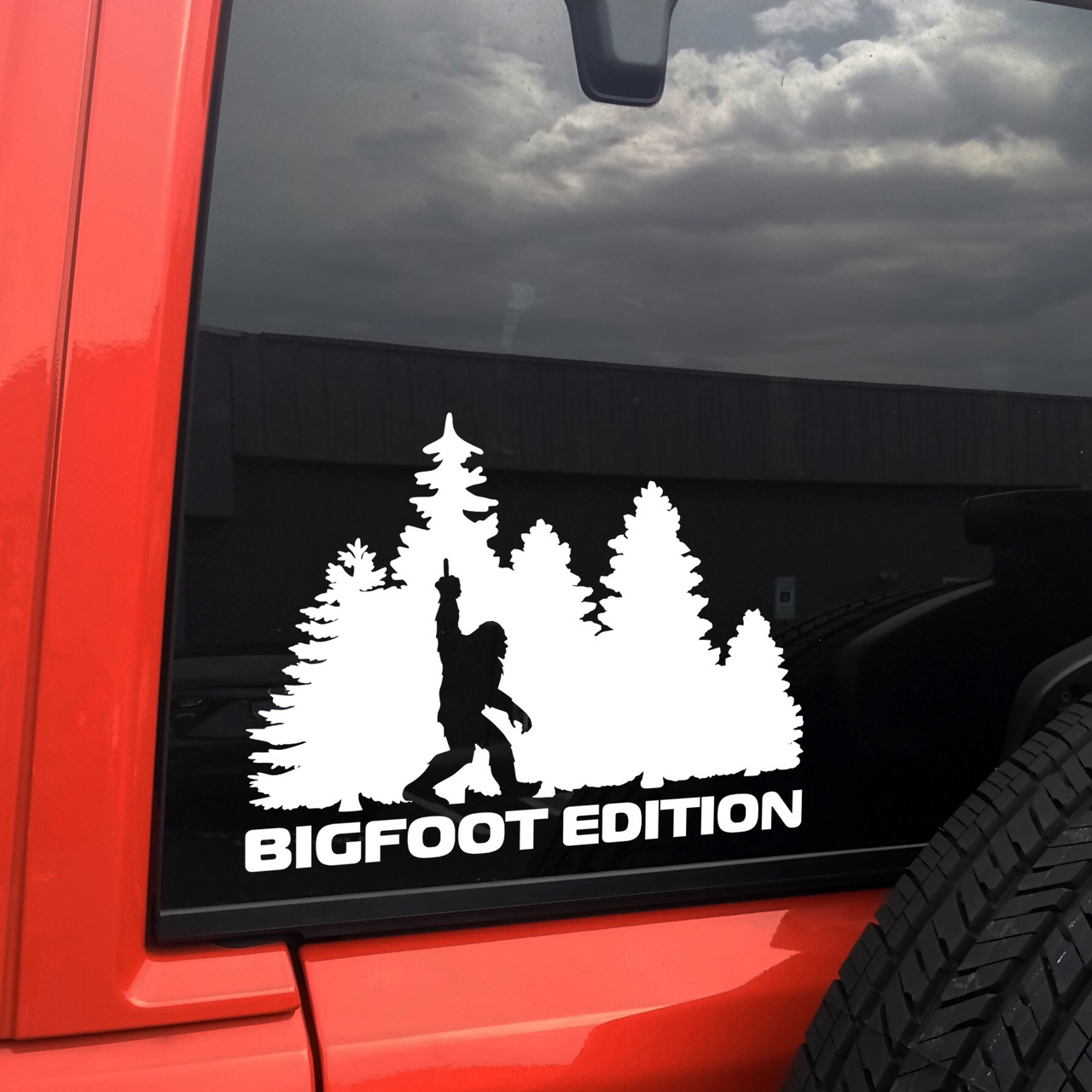 bigfoot edition forest vinyl sticker decal featuring sasquatch walking through pine trees with humorous rebellious gesture