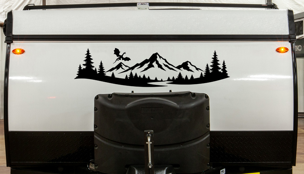 mountain dragon vinyl sticker decal featuring a flying dragon above mountain peaks and pine forest landscape designed for rvs campers travel trailers and teardrop campers