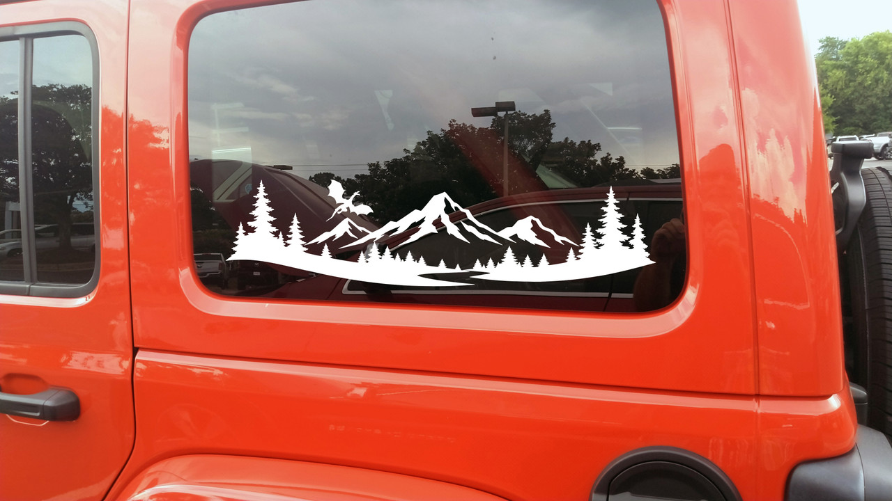 mountain dragon vinyl sticker decal featuring a flying dragon above mountain peaks and pine forest landscape designed for rvs campers travel trailers and teardrop campers