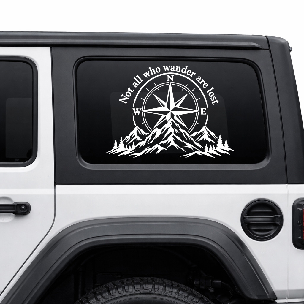 Not All Who Wander Are Lost vinyl decal featuring a compass rose, mountain range, and evergreen forest for RVs, campers, trucks, SUVs, travel trailers, and overland vehicles.