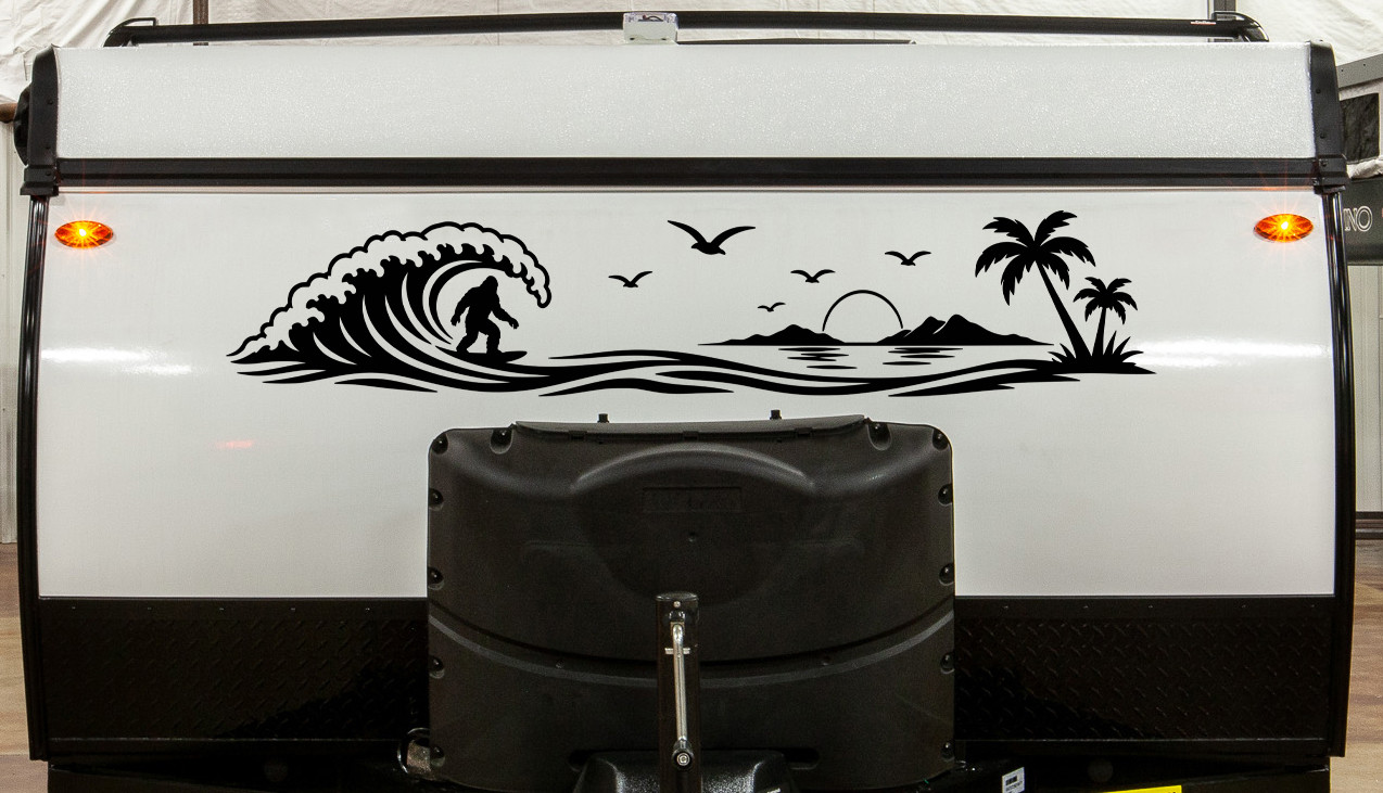 Bigfoot Surfing Beach Scene vinyl decal featuring Sasquatch riding a wave with palm trees, a tropical island, seabirds, and a setting sun.