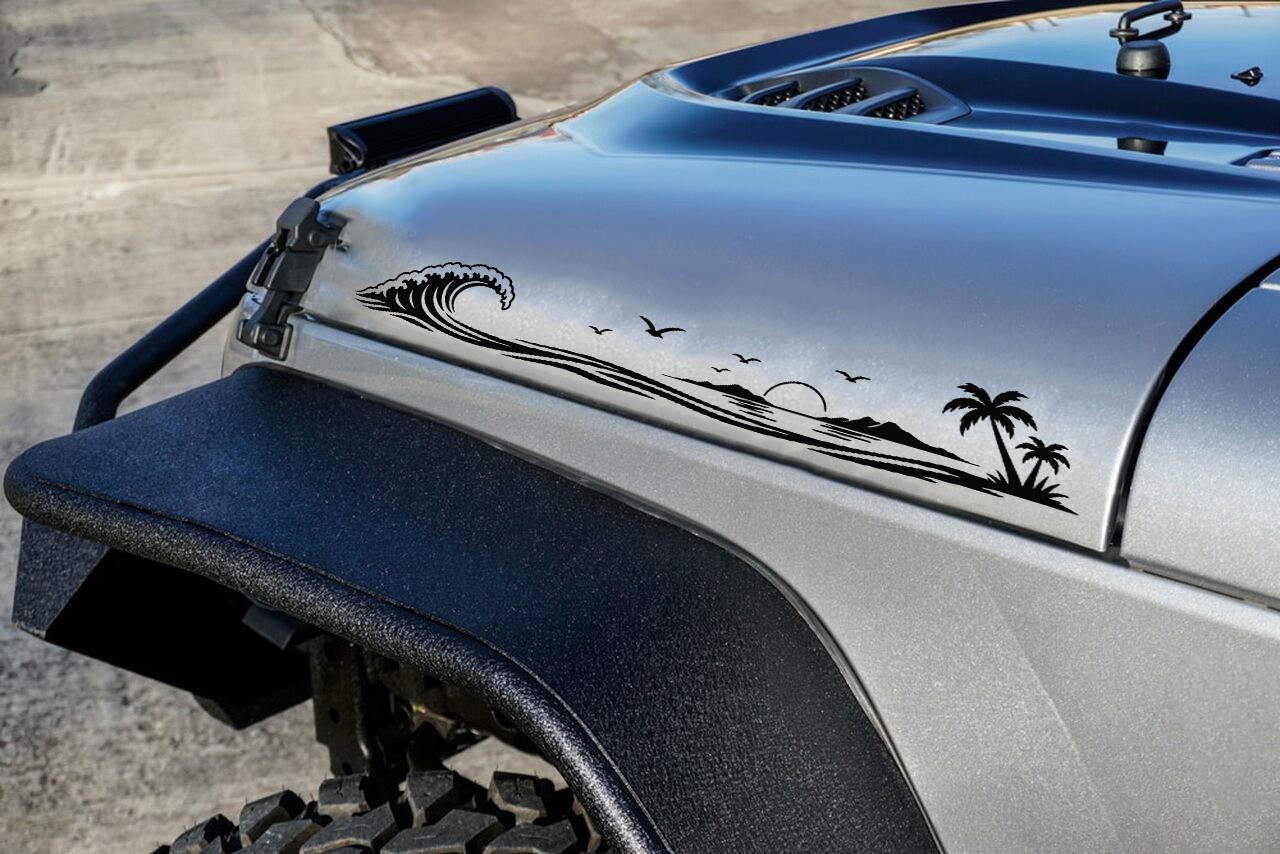 Pair of beach wave vinyl decals featuring a tropical island, palm trees, seabirds, and a setting sun for truck hood sides, RVs, campers, travel trailers, and motorhomes.
