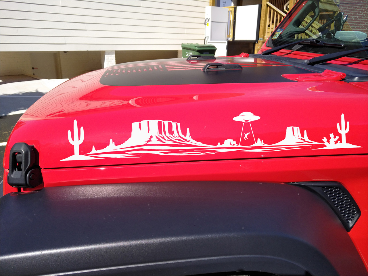 Pair of desert UFO abduction vinyl decals featuring mesas, saguaro cacti, and an alien spacecraft for trucks, campers, RVs, and travel trailers.