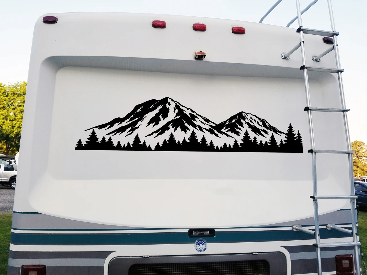 Pagosa Peak Colorado mountain and evergreen forest vinyl decal displayed on rear of RV camper