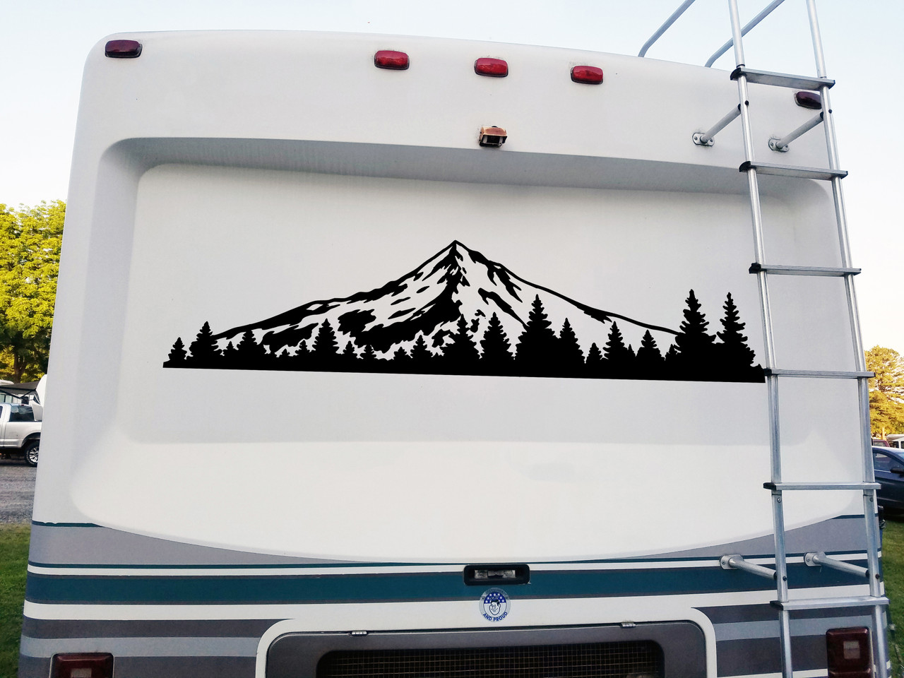 Mount Hood vinyl decal featuring the Oregon mountain above an evergreen pine forest displayed on the rear of an RV camper