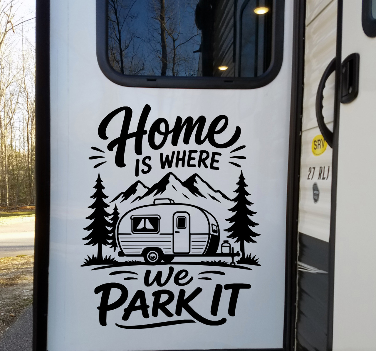 Home Is Where We Park It vinyl decal featuring a travel trailer, mountain peaks and pine trees displayed on a camper exterior