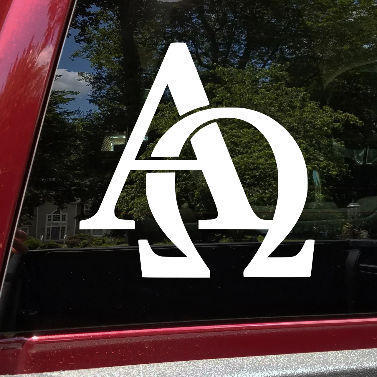 Alpha Omega Christian faith symbol vinyl decal displayed on a vehicle window