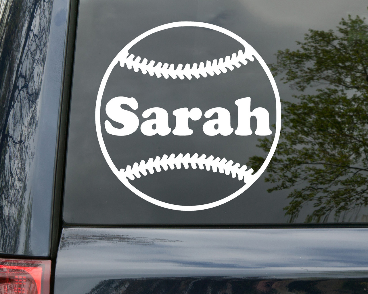 Personalized softball vinyl decal featuring stitched ball design with custom player name across center