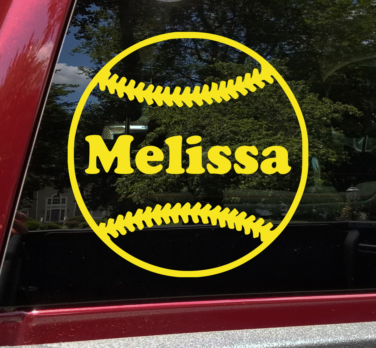 Personalized softball vinyl decal featuring stitched ball design with custom player name across center