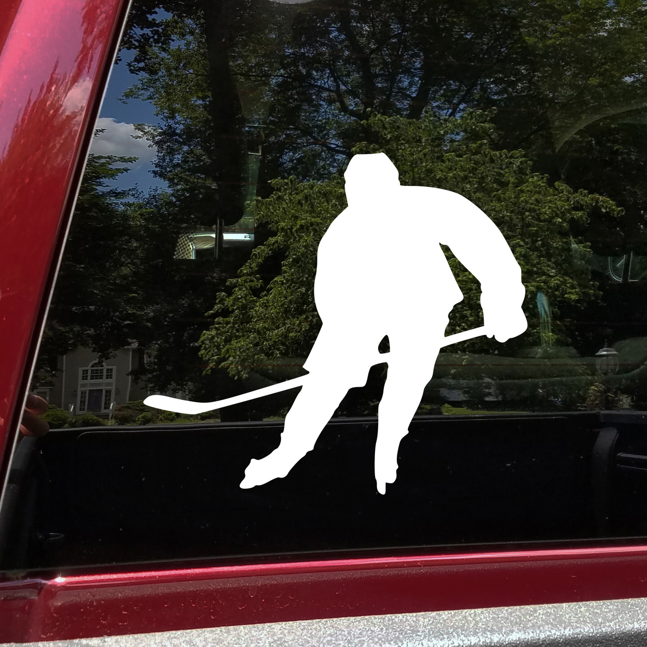 Ice hockey player skating vinyl decal silhouette with hockey stick