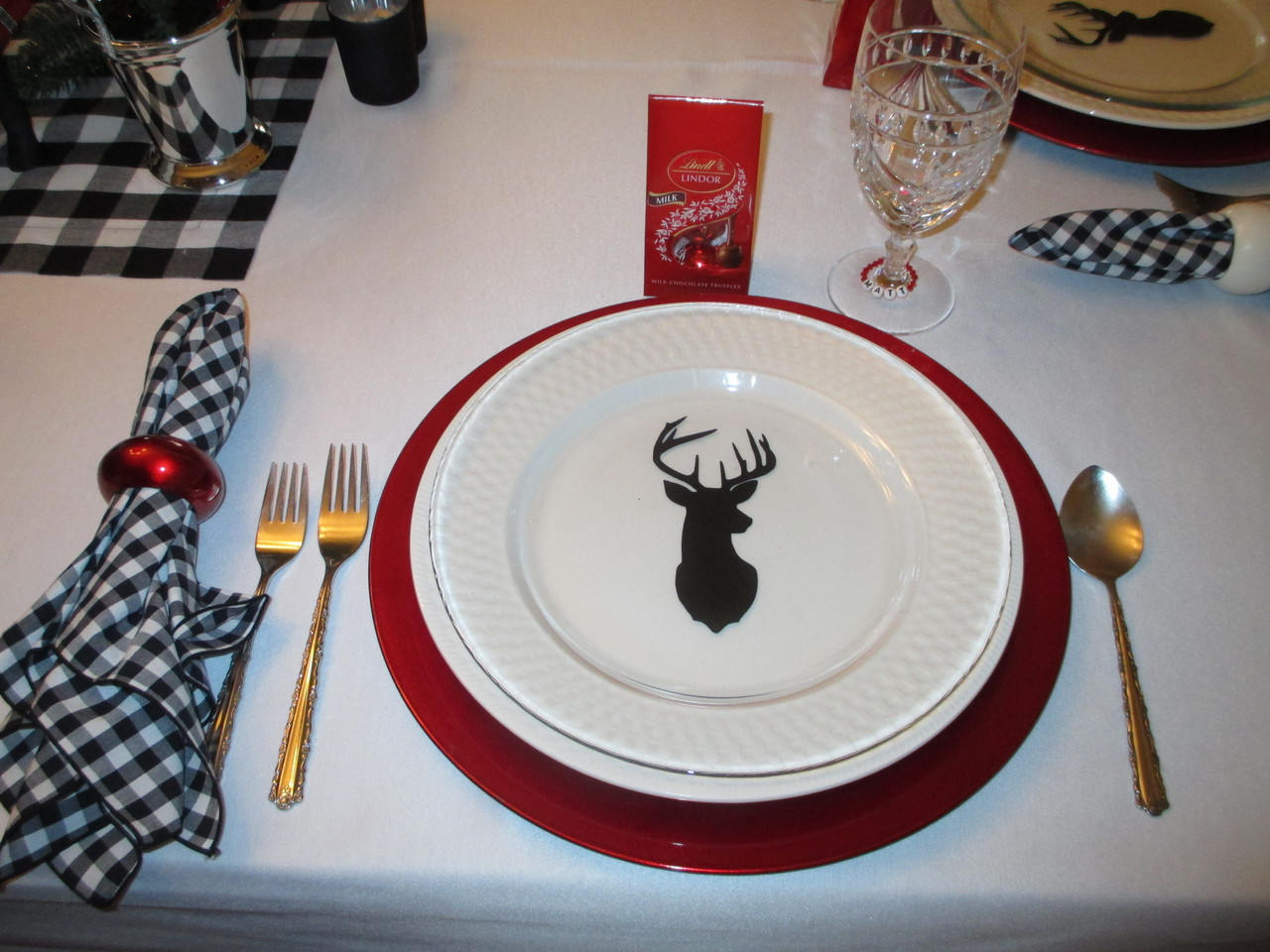 Deer head silhouette vinyl decal featuring a side profile buck with large branching antlers