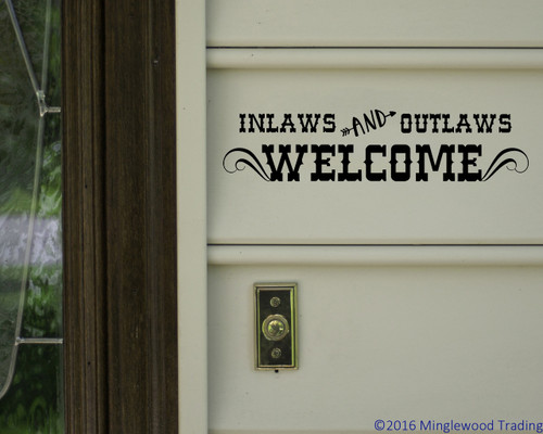 'Inlaws and Outlaws Welcome' vinyl decal next to a door - ideal funny door sign and Grandma house sign