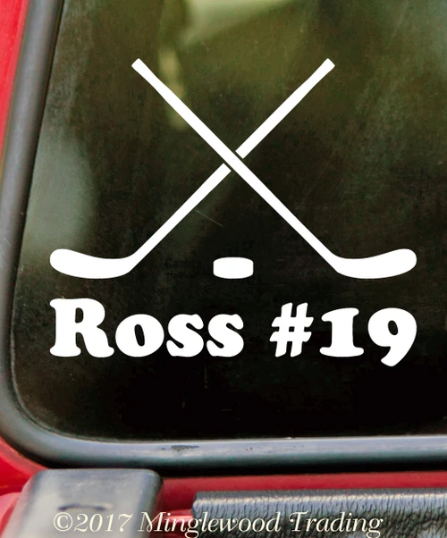 Personalized crossed hockey sticks and puck vinyl decal with custom player name and jersey number, available in six sizes from 4 x 3.25 inches to 15 x 12 inches