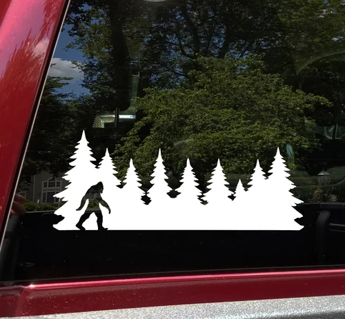 Bigfoot Sasquatch walking silhouette within a continuous pine forest tree line vinyl decal for RV campers travel trailers and trucks