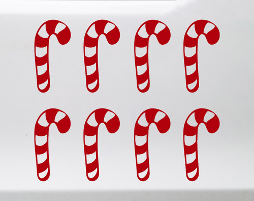 Set of eight striped candy cane Christmas vinyl decals arranged in two rows of four on a glass window, featuring traditional curved hooks and peppermint stripe cutouts