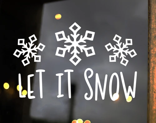 Let It Snow winter vinyl window decal featuring three decorative snowflakes above playful hand-lettered holiday typography