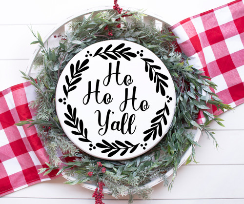 Ho Ho Ho Y'all Christmas vinyl window decal featuring Southern holiday script lettering surrounded by a circular leafy wreath with decorative berry accents
