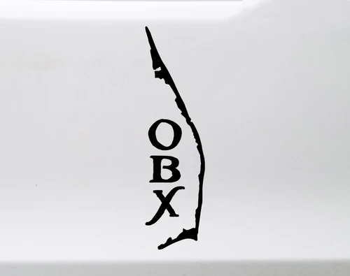 Outer Banks North Carolina coastline map vinyl decal with vertical OBX lettering, displayed in white on a tinted truck window, available in nine sizes and multiple colors.