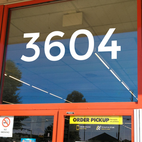 Large storefront address numbers vinyl decal in Montserrat font with modern minimalist business signage style