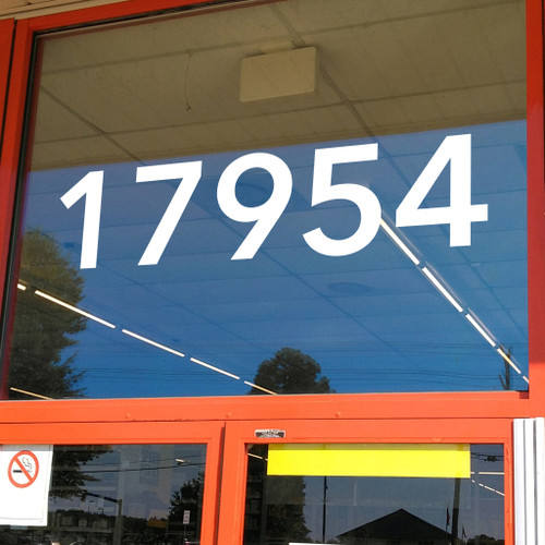 Large storefront address numbers vinyl decal in Avenir Next Demi font with modern minimalist business signage style