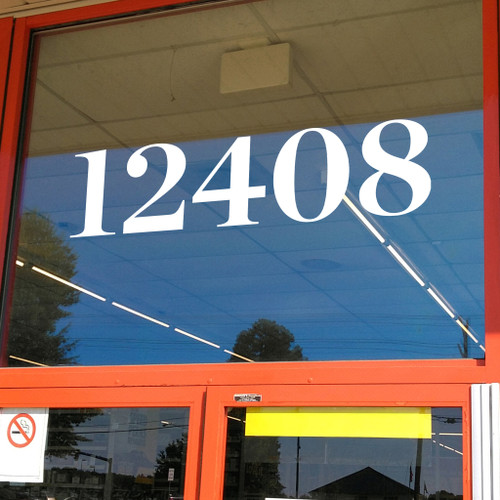Chronicle Display Bold storefront address numbers vinyl sticker decal applied to business window with elegant serif lettering