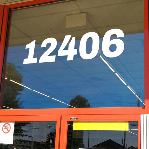 large Archivo Black vinyl storefront numbers applied to modern business window with bold wide geometric typography