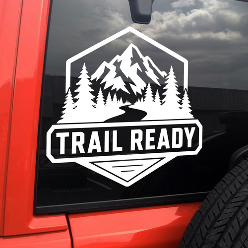 trail ready vinyl decal featuring mountains pine trees and a winding trail designed for off road vehicles overland rigs trucks suvs campers and outdoor adventure enthusiasts