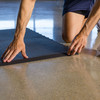 BaseLayer gym tiles being installed with edges