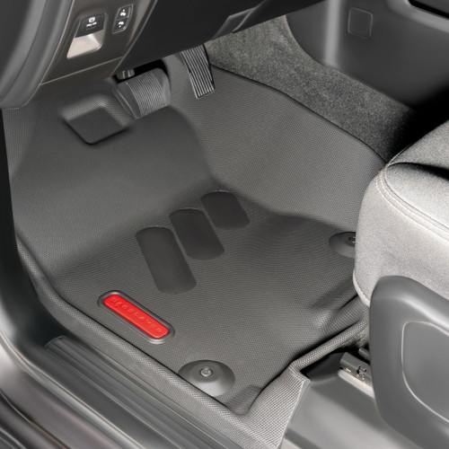 RAM DT 1500 front crew cab floor liners installed with red logo