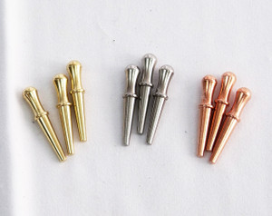 9 cribbage pegs in brass, steel, and copper.