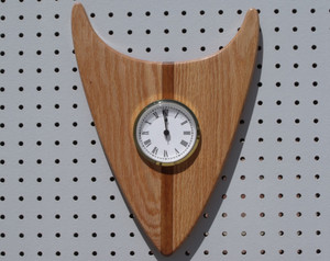 The clock in the rustic arrowhead direction.