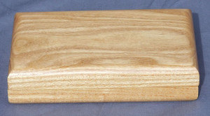 The closed clamshell keepsake box made from honey locust wood.