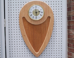 The front of the mahogany wall clock.