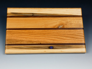 A top view of one side of the multi-wood serving board.
