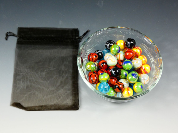 Replacement Chinese Checkers Marbles in a bowl next to the storage bag