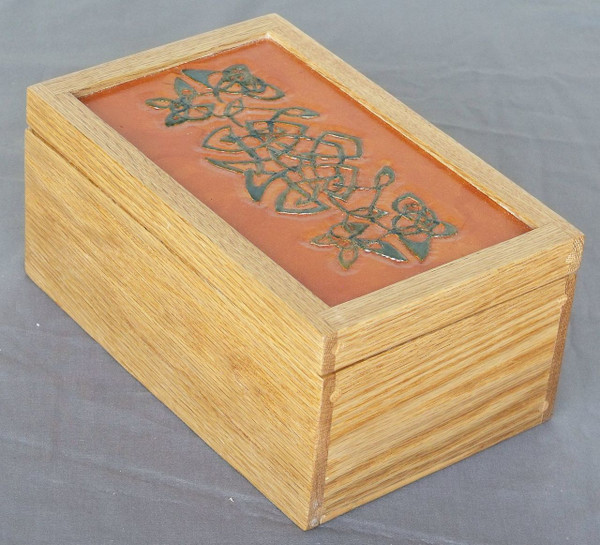 The back perspective of the red oak box, showcasing the seamless, flush look of the invisible barrel hinges and the clean appearance of the hand-cut oak dowels pinning the corners.