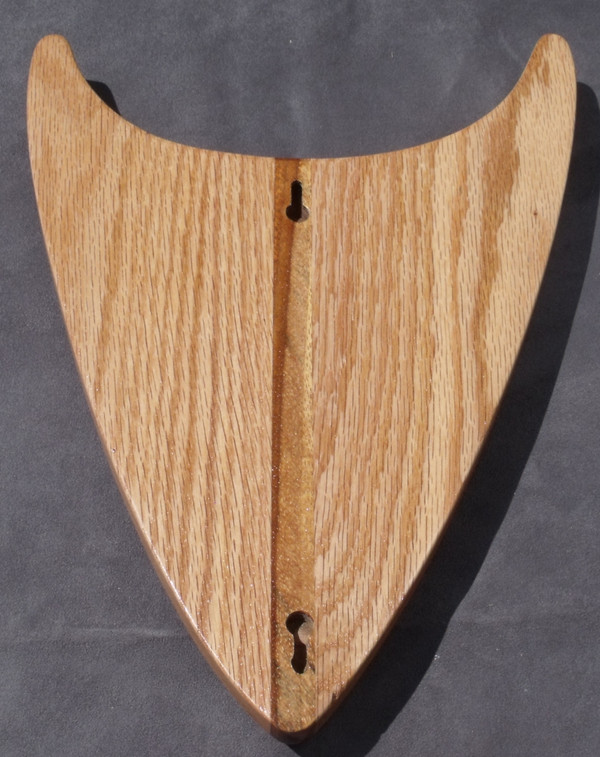 The back of the clock showing the two different slots for hanging.