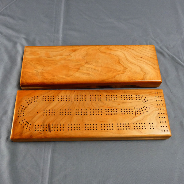 Top and bottom of the Cherry 3 Player Cribbage Board showing how the wood may vary.